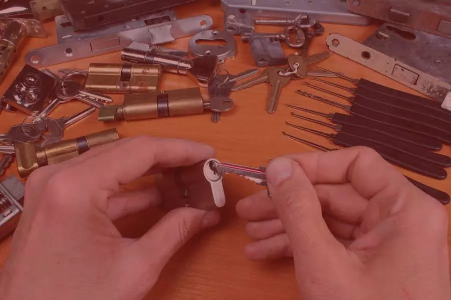 Emergency locksmith picking a lock in Manchester